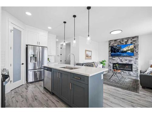 1033 Iron Landing Way, Crossfield, AB - Indoor Photo Showing Kitchen With Double Sink With Upgraded Kitchen