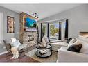 147 Citadel Drive Nw, Calgary, AB  - Indoor Photo Showing Living Room With Fireplace 