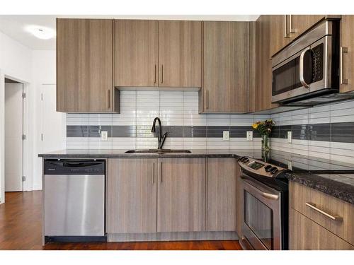 3-8 Sage Hill Terrace Nw, Calgary, AB - Indoor Photo Showing Kitchen With Upgraded Kitchen