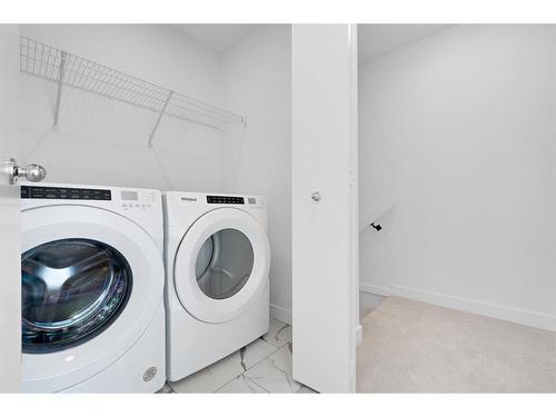 1304-280 Chelsea Road, Chestermere, AB - Indoor Photo Showing Laundry Room