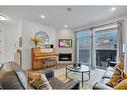 2-1922 25A Street Sw, Calgary, AB  - Indoor Photo Showing Living Room With Fireplace 