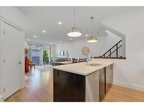 2-1922 25A Street Sw, Calgary, AB - Indoor Photo Showing Kitchen With Double Sink