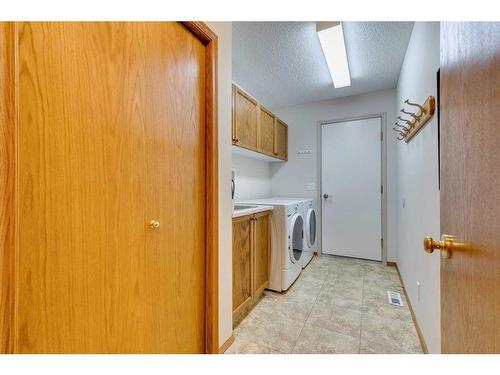 20 Arbour Cliff Close Nw, Calgary, AB - Indoor Photo Showing Laundry Room