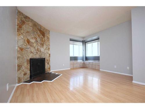 136 Bedfield Close Ne, Calgary, AB - Indoor With Fireplace