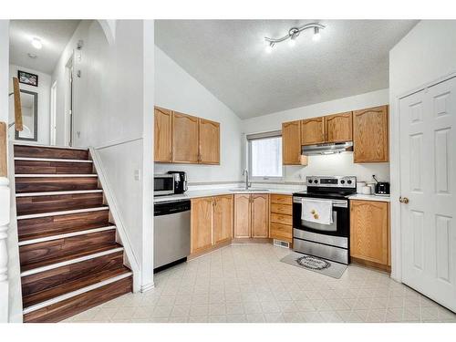 86 Taradale Drive Ne, Calgary, AB - Indoor Photo Showing Kitchen With Stainless Steel Kitchen With Double Sink