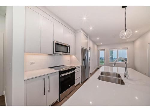 1305-395 Skyview Parkway Ne, Calgary, AB - Indoor Photo Showing Kitchen With Stainless Steel Kitchen With Double Sink With Upgraded Kitchen