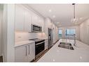 1305-395 Skyview Parkway Ne, Calgary, AB  - Indoor Photo Showing Kitchen With Stainless Steel Kitchen With Double Sink With Upgraded Kitchen 