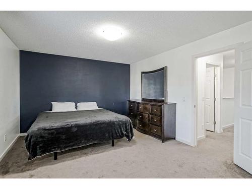 55 Sunset Link, Cochrane, AB - Indoor Photo Showing Bedroom