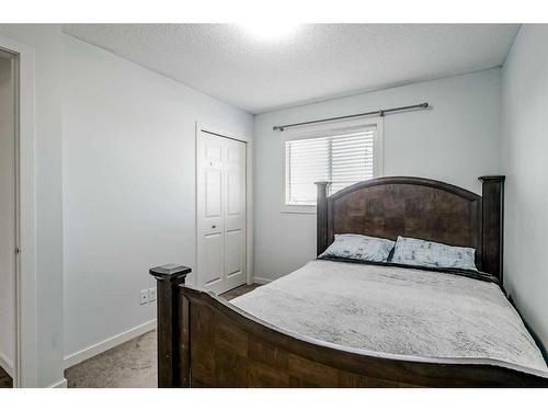 55 Sunset Link, Cochrane, AB - Indoor Photo Showing Bedroom