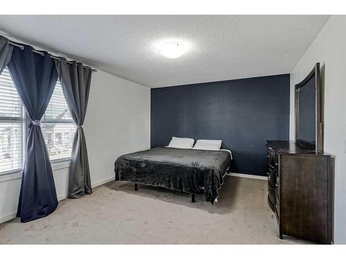 55 Sunset Link, Cochrane, AB - Indoor Photo Showing Bedroom