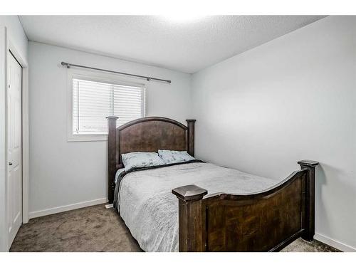 55 Sunset Link, Cochrane, AB - Indoor Photo Showing Bedroom