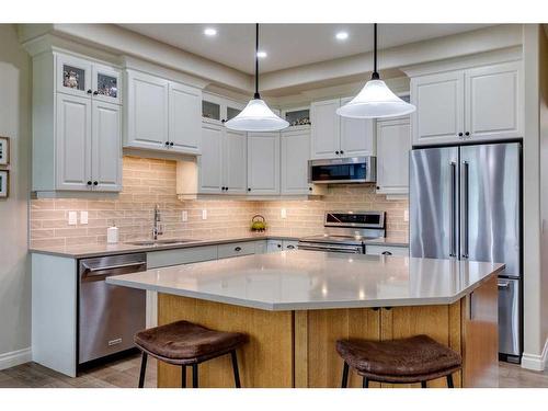 18 Discovery Woods Villas Sw, Calgary, AB - Indoor Photo Showing Kitchen With Stainless Steel Kitchen With Upgraded Kitchen