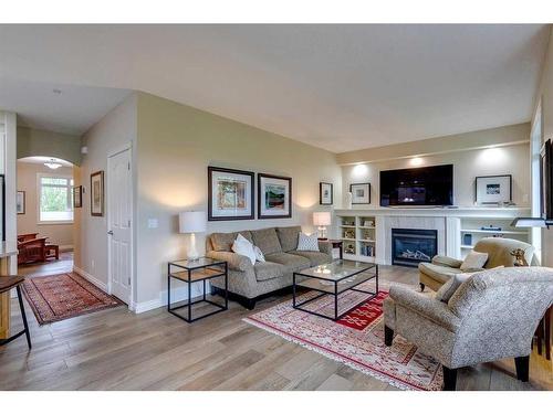 18 Discovery Woods Villas Sw, Calgary, AB - Indoor Photo Showing Living Room With Fireplace