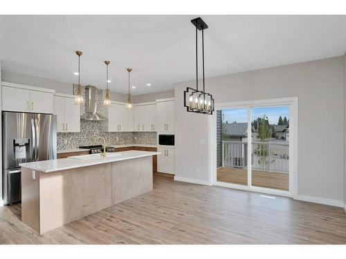 714 5 Street Sw, Sundre, AB - Indoor Photo Showing Kitchen With Stainless Steel Kitchen With Double Sink With Upgraded Kitchen