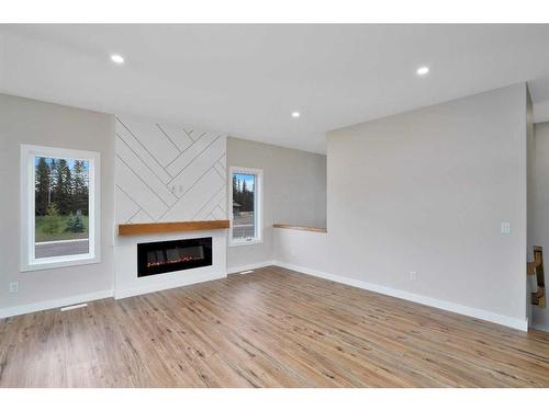 714 5 Street Sw, Sundre, AB - Indoor Photo Showing Living Room With Fireplace