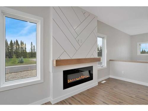 714 5 Street Sw, Sundre, AB - Indoor Photo Showing Living Room With Fireplace