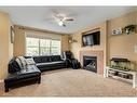 6 Silverado Saddle Heights Sw, Calgary, AB  - Indoor Photo Showing Living Room With Fireplace 