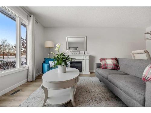 91 Midglen Way Se, Calgary, AB - Indoor Photo Showing Living Room With Fireplace