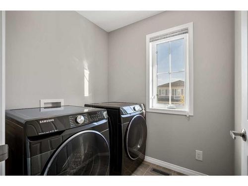 284 Carrington Way Nw, Calgary, AB - Indoor Photo Showing Laundry Room