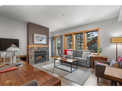 226-101 Montane Road, Canmore, AB - Indoor Photo Showing Living Room With Fireplace