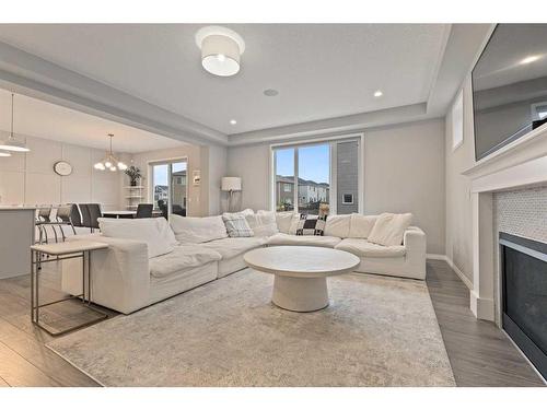 235 Cityside Road Ne, Calgary, AB - Indoor Photo Showing Living Room With Fireplace