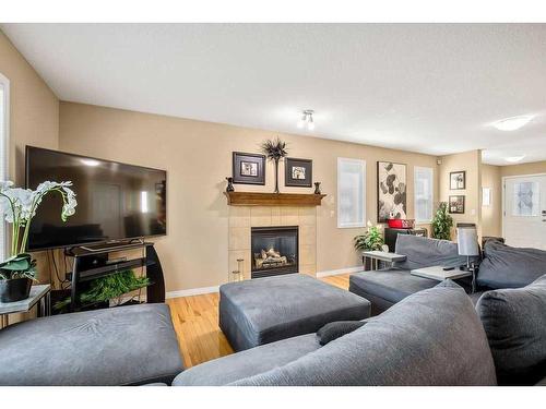 262 Evanscreek Court Nw, Calgary, AB - Indoor Photo Showing Living Room With Fireplace