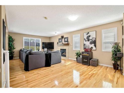 262 Evanscreek Court Nw, Calgary, AB - Indoor Photo Showing Living Room With Fireplace