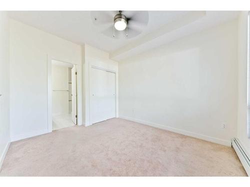 103-15233 1 Street Se, Calgary, AB - Indoor Photo Showing Other Room