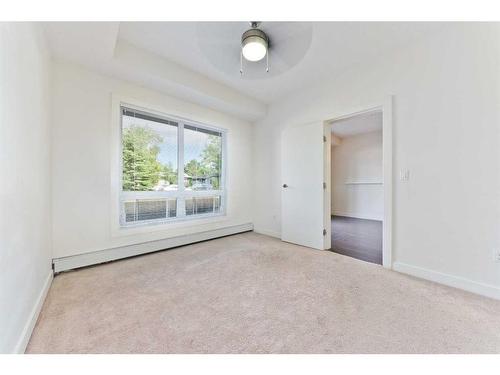 103-15233 1 Street Se, Calgary, AB - Indoor Photo Showing Other Room