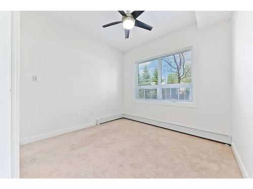 103-15233 1 Street Se, Calgary, AB - Indoor Photo Showing Other Room