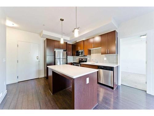 103-15233 1 Street Se, Calgary, AB - Indoor Photo Showing Kitchen With Stainless Steel Kitchen