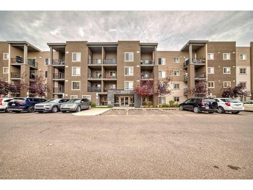 8410-403 Mackenzie Way Sw, Airdrie, AB - Outdoor With Balcony With Facade