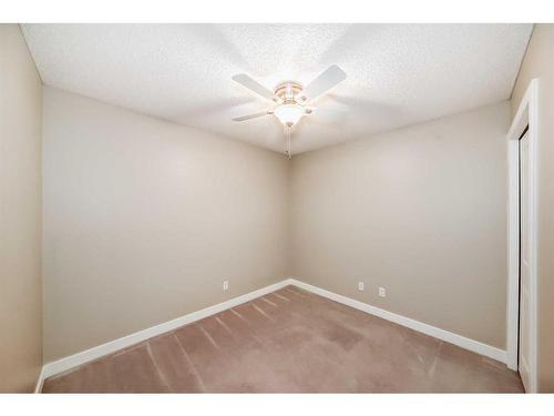 8410-403 Mackenzie Way Sw, Airdrie, AB - Indoor Photo Showing Other Room