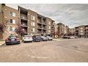 8410-403 Mackenzie Way Sw, Airdrie, AB  - Outdoor With Balcony With Facade 