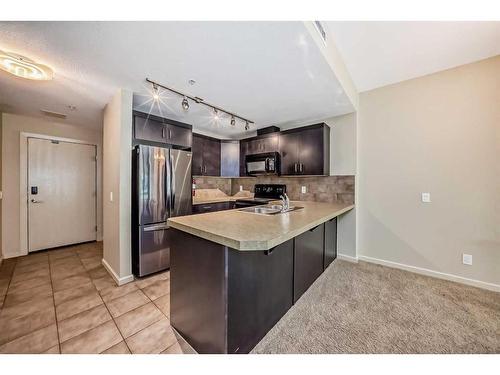 204-1410 1 Street Se, Calgary, AB - Indoor Photo Showing Kitchen