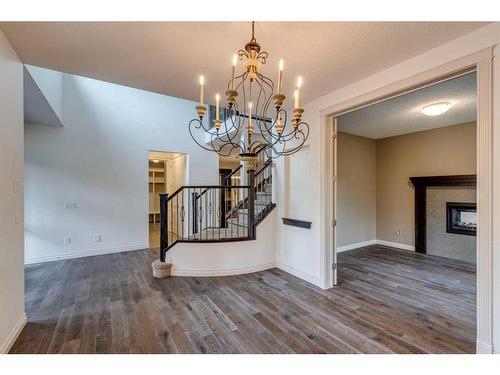 509 Hawk'S Nest Lane, Priddis Greens, AB - Indoor Photo Showing Other Room With Fireplace