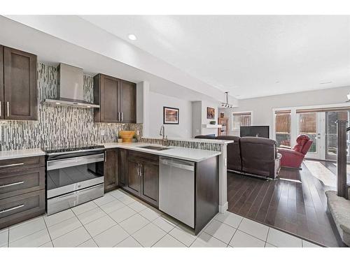 88 Cougar Ridge Landing Sw, Calgary, AB - Indoor Photo Showing Kitchen With Double Sink