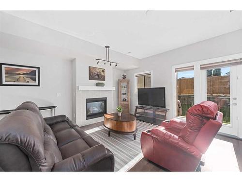 88 Cougar Ridge Landing Sw, Calgary, AB - Indoor Photo Showing Living Room With Fireplace