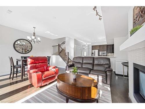 88 Cougar Ridge Landing Sw, Calgary, AB - Indoor Photo Showing Living Room