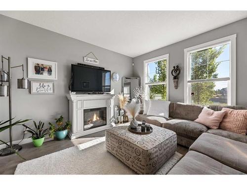 272 Midyard Lane Sw, Airdrie, AB - Indoor Photo Showing Living Room With Fireplace