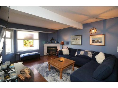 42-567 Edmonton Trail Ne, Airdrie, AB - Indoor Photo Showing Living Room With Fireplace