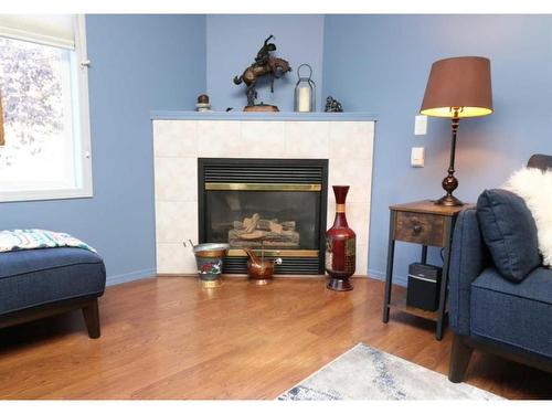 42-567 Edmonton Trail Ne, Airdrie, AB - Indoor Photo Showing Living Room With Fireplace