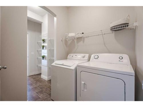 134 Coopers Bay Sw, Airdrie, AB - Indoor Photo Showing Laundry Room