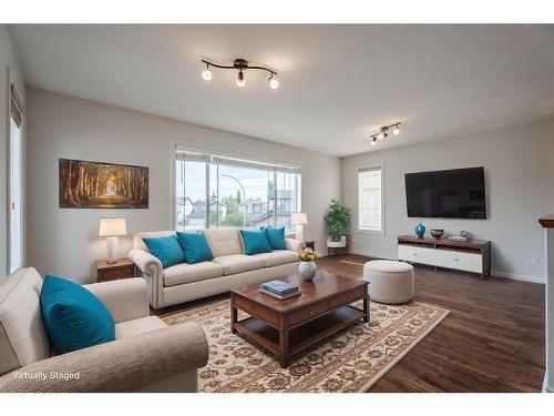 134 Coopers Bay Sw, Airdrie, AB - Indoor Photo Showing Living Room