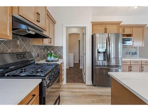 134 Coopers Bay Sw, Airdrie, AB - Indoor Photo Showing Kitchen With Stainless Steel Kitchen