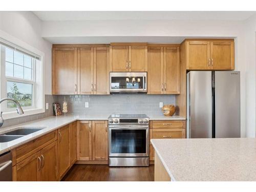 130 Reunion Landing Nw, Airdrie, AB - Indoor Photo Showing Kitchen With Double Sink