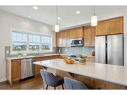 130 Reunion Landing Nw, Airdrie, AB - Indoor Photo Showing Kitchen With Upgraded Kitchen