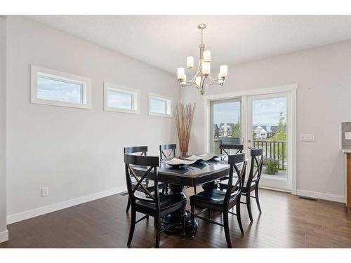 130 Reunion Landing Nw, Airdrie, AB - Indoor Photo Showing Dining Room With Fireplace