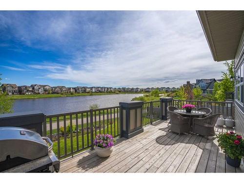 130 Reunion Landing Nw, Airdrie, AB - Outdoor With Body Of Water With Deck Patio Veranda With View With Exterior