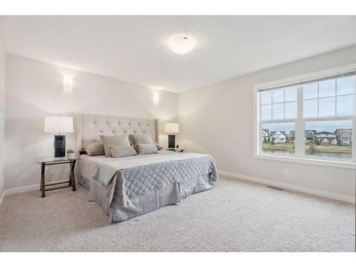 130 Reunion Landing Nw, Airdrie, AB - Indoor Photo Showing Bedroom